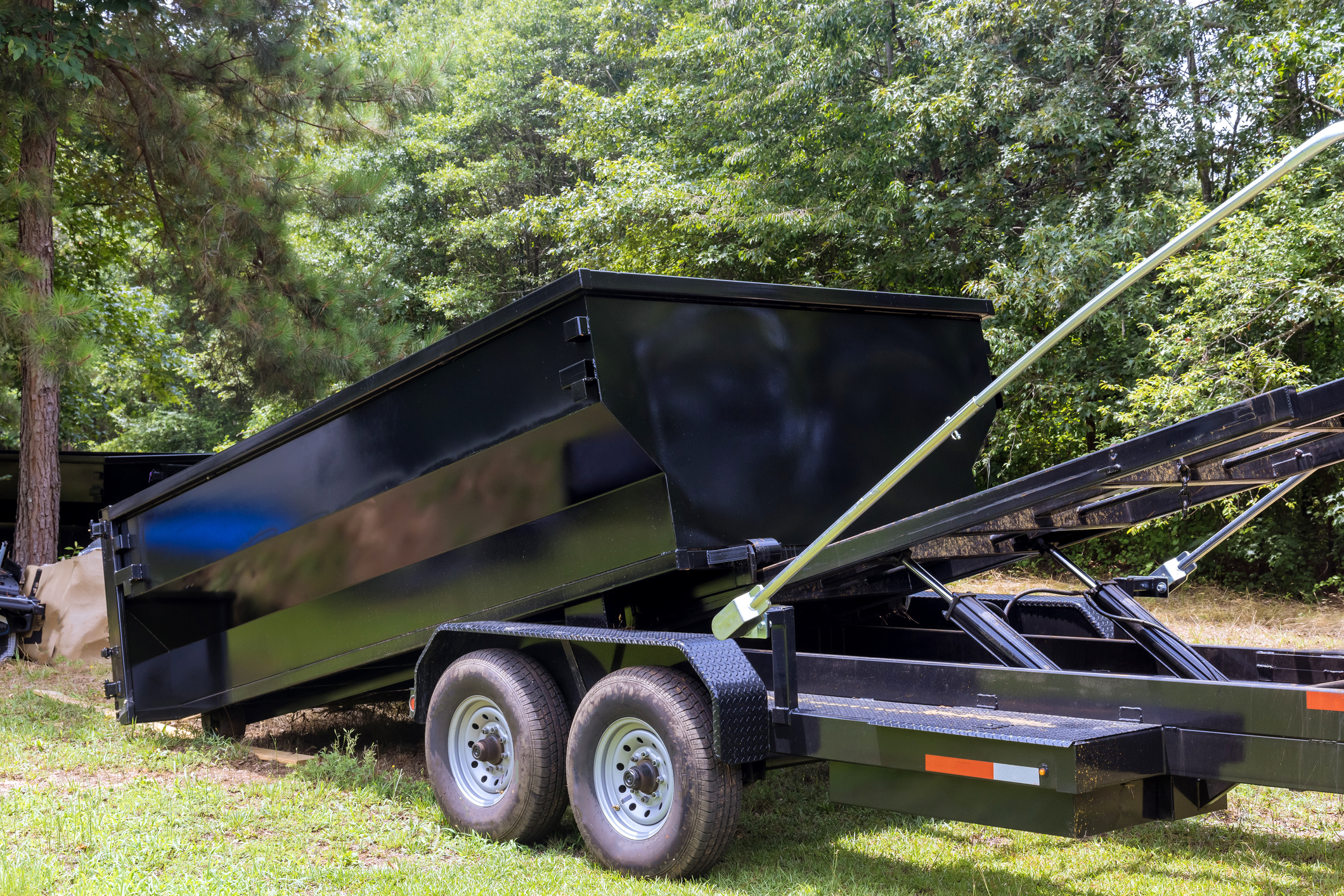 In order to gather recycle garbage, a metal container trash dumpster is used
